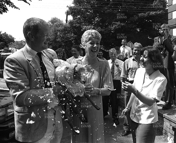 250794 - Picture shows John Bennett and his 'bride' Gerwyn the sheep being showered with confetti in Tredegar, South Wales