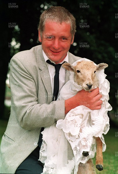 250794 - Picture shows John Bennett and his 'bride' Gerwyn the sheep  in Tredegar, South Wales