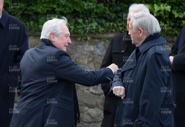 060521 - John Dawes Funeral, Llandaff Cathedral, Cardiff -  Sir Gareth Edwards elbow bumps Sir Stanley Thomas at the funeral of former Wales and British Lions captain and coach John Dawes at Llandaff Cathedral, Cardiff