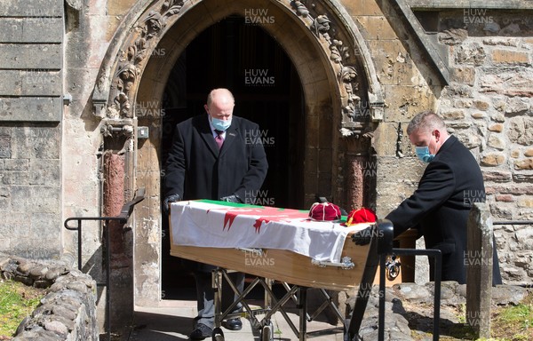 060521 - John Dawes Funeral, Llandaff Cathedral, Cardiff - The coffin of former Wales and British Lions captain and coach John Dawes is draped with a Welsh flag and accompanied by his Wales and British Lions caps as it is taken into Llandaff Cathedral, Cardiff