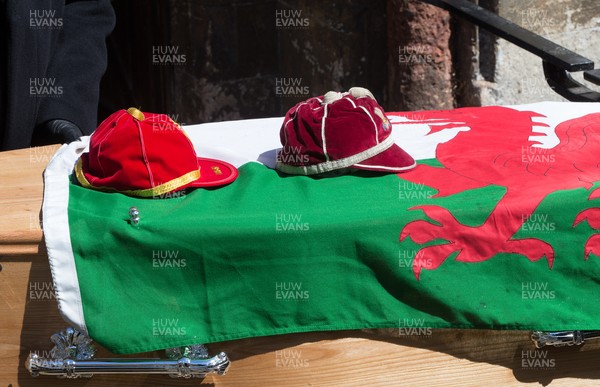 060521 - John Dawes Funeral, Llandaff Cathedral, Cardiff - The coffin of former Wales and British Lions captain and coach John Dawes is draped with a Welsh flag and accompanied by his Wales and British Lions caps as it is taken into Llandaff Cathedral, Cardiff