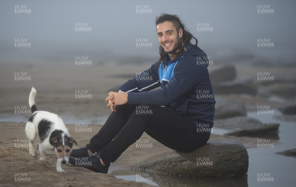221217 - Interview by David Walsh  Cardiff Blues and Wales flanker Josh Navidi with a passer-bys dog at Southerndown Beach, South Wales 