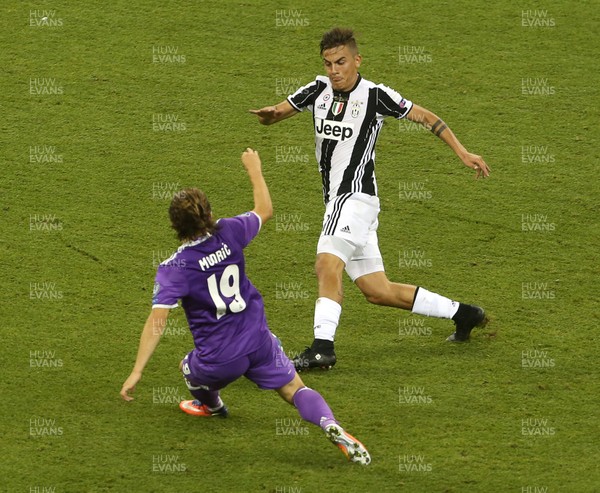 030617 - UEFA Champions League Final - Juventus v Real Madrid - Paulo Dybala of Juventus collides with Luka Modric of Real Madrid