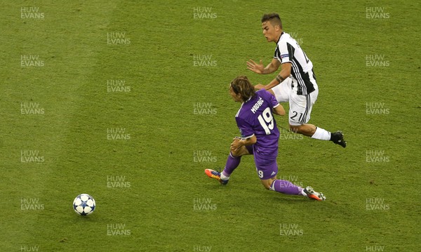 030617 - UEFA Champions League Final - Juventus v Real Madrid - Paulo Dybala of Juventus collides with Luka Modric of Real Madrid