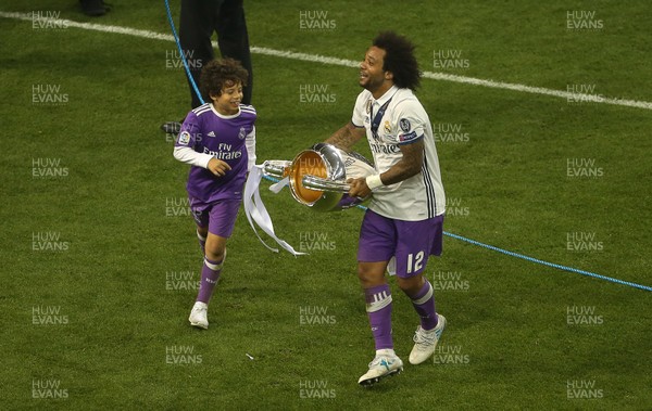 030617 - UEFA Champions League Final - Juventus v Real Madrid - Marcelo of Real Madrid celebrates with the trophy