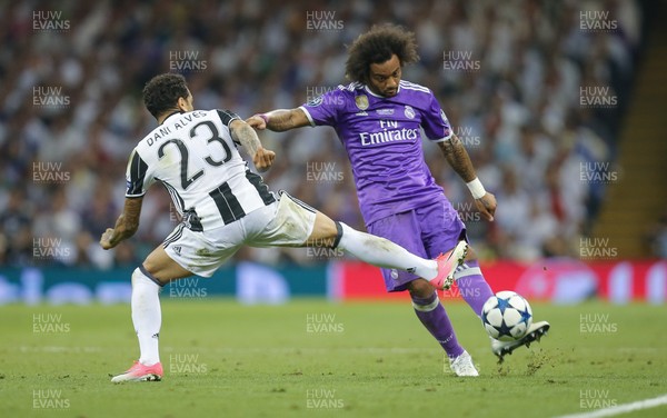 030617 - Juventus v Real Madrid, UEFA Champions League Final, Cardiff - Marcelo of Real Madrid is challenged by Dani Alves of Juventus