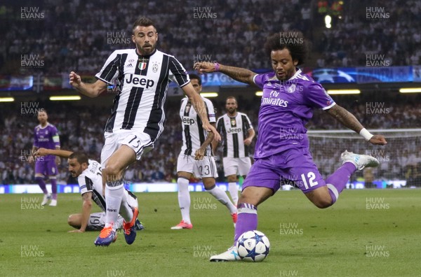 030617 - Juventus v Real Madrid, UEFA Champions League Final, Cardiff - Marcelo of Real Madrid crosses the ball as Andrea Barzagli of Juventus closes in