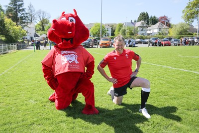 030525 - Lampeter Town RFC v London Welsh - London Welsh mascot Dewi the Dragon assists Rugby referee Nigel Owens with his warm up as he comes out of retirement and returns to the field for Lampeter Town RFC v London Welsh