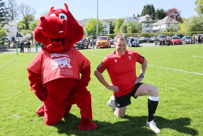 030525 - Lampeter Town RFC v London Welsh - London Welsh mascot Dewi the Dragon assists Rugby referee Nigel Owens with his warm up as he comes out of retirement and returns to the field for Lampeter Town RFC v London Welsh
