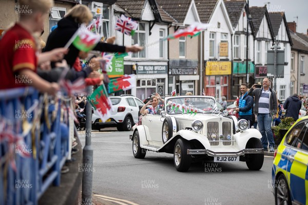030921 - Picture shows the crowds out in Ystard Mynach to welcome local heros Lauren Price (left) and Lauren Williams (right) who are taken around the town in an open top car to celebrate their success at the Tokyo games