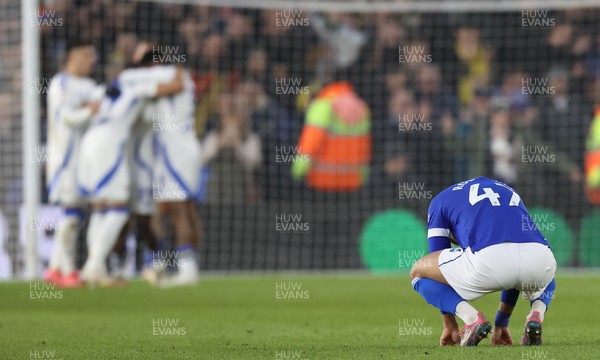 010225 - Leeds United v Cardiff City - Sky Bet Championship - Callum Robinson of Cardiff in despair as Number 7 goes in for Leeds with Leeds celebrating by goal mouth