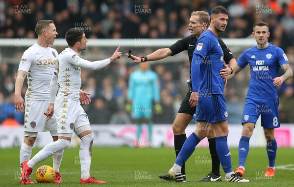 030218 - Leeds United v Cardiff City - Sky Bet Championship -  Gary Madine of Cardiff is led away from controversy by referee Graham Scott