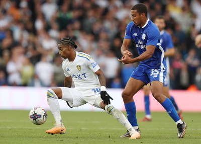 060823 - Leeds United v Cardiff City - Sky Bet Championship - Andy Rinomhota of Cardiff and Crysencio Summerville of Leeds United