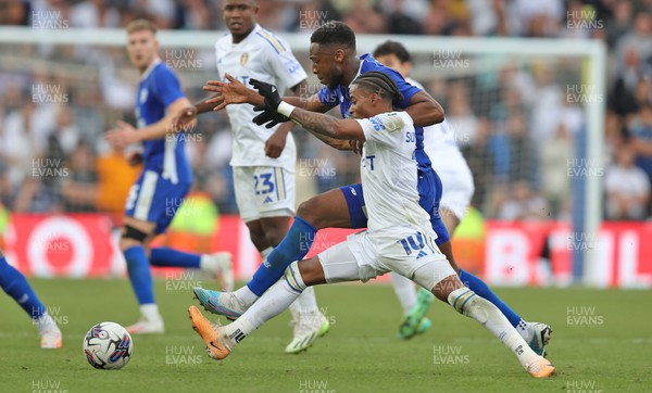 060823 - Leeds United v Cardiff City - Sky Bet Championship - Ebou Adams of Cardiff and Crysencio Summerville of Leeds United