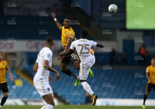 220817 - Leeds United v Newport County - Carabao Cup - Shawn McCoulsky of Newport County beats Ronaldo Vieira of Leeds United to the ball