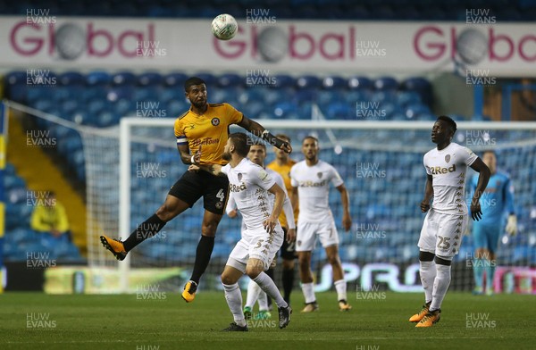 220817 - Leeds United v Newport County - Carabao Cup - Joss Labadie of Newport County gets above Cameron Borthwick-Jackson of Leeds United