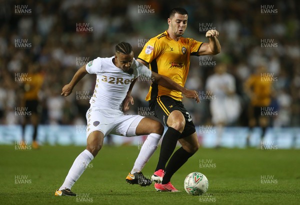 220817 - Leeds United v Newport County - Carabao Cup - Joe Quigley of Newport County is tackled by Cameron Borthwick-Jackson of Leeds United