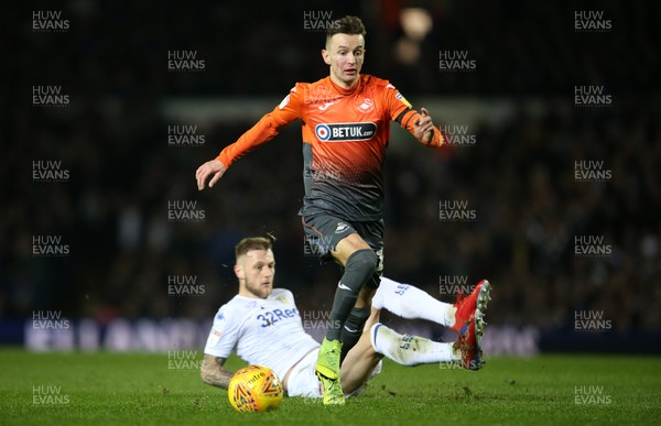 130219 - Leeds United v Swansea City - SkyBet Championship - Bersant Celina of Swansea City is challenged by Kalvin Phillips of Leeds