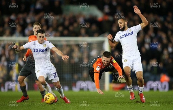 130219 - Leeds United v Swansea City - SkyBet Championship - Matt Grimes of Swansea City is tackled by Kemar Roofe of Leeds