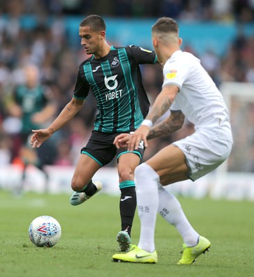 310819 - Leeds United v Swansea City - Sky Bet Championship -  Yan Dhanda  of Swansea is caught by Stuart Dallas of Leeds United