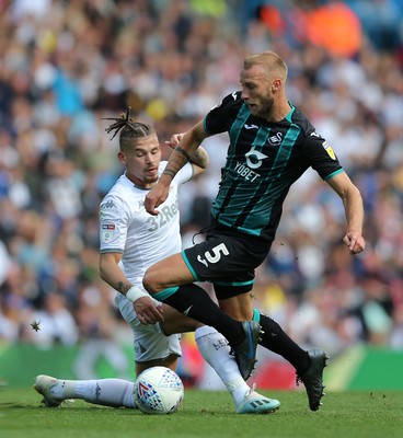 310819 - Leeds United v Swansea City - Sky Bet Championship -  Mike Van der Hoorn  of Swansea is stopped by Kalvin Phillips of Leeds United