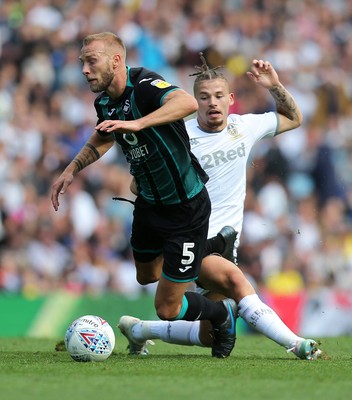 310819 - Leeds United v Swansea City - Sky Bet Championship -  Mike Van der Hoorn  of Swansea is stopped by Kalvin Phillips of Leeds United