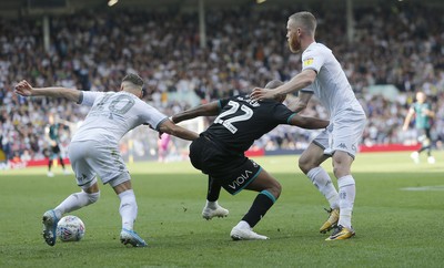 310819 - Leeds United v Swansea City - Sky Bet Championship -  Andre Ayew of Swansea is taken off the ball by Ezgjan Alioski of Leeds United and Adam Forshaw of Leeds United