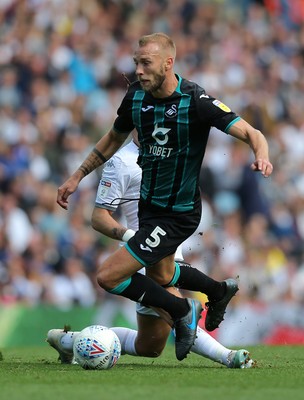 310819 - Leeds United v Swansea City - Sky Bet Championship -  Mike Van der Hoorn  of Swansea is tripped by Kalvin Phillips of Leeds United