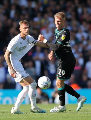 310819 - Leeds United v Swansea City - Sky Bet Championship -  Sam Surridge of Swansea tussles with Liam Cooper of Leeds United for the ball