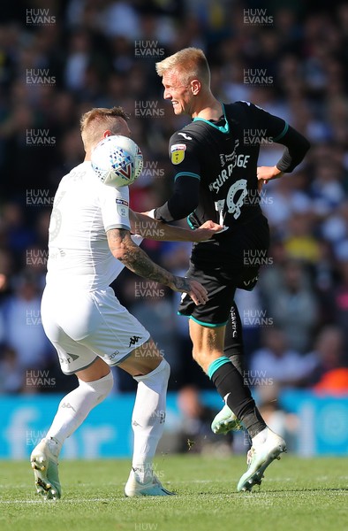 310819 - Leeds United v Swansea City - Sky Bet Championship -  Sam Surridge of Swansea tussles with Liam Cooper of Leeds United for the ball