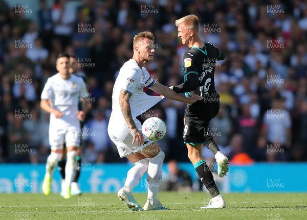 310819 - Leeds United v Swansea City - Sky Bet Championship -  Sam Surridge of Swansea tussles with Liam Cooper of Leeds United for the ball