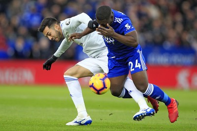 291218 - Leicester City v Cardiff City, Premier League - Victor Camarasa of Cardiff City (left) and Nampalys Mendy of Leicester City battle for the ball