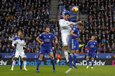 291218 - Leicester City v Cardiff City, Premier League - Wilfred Ndidi of Leicester City out jumps Sean Morrison of Cardiff City