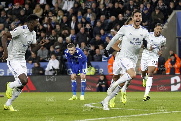 291218 - Leicester City v Cardiff City, Premier League - Victor Camarasa of Cardiff City (right) celebrates scoring his side's first goal with team-mates as Leicester City players look dejected