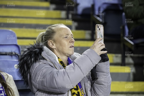 081122 - Leicester City v Newport County - Carabao Cup Third Round - A Newport fan takes a picture on their phone 