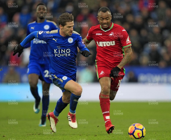 030218 - Leicester City v Swansea City, Premier League - Jordan Ayew of Swansea City (right) and Adrien Silva of Leicester City battle for the ball