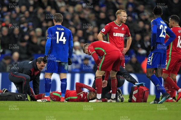 030218 - Leicester City v Swansea City, Premier League - Leroy Fer of Swansea City receives treatment after sustaining an injury