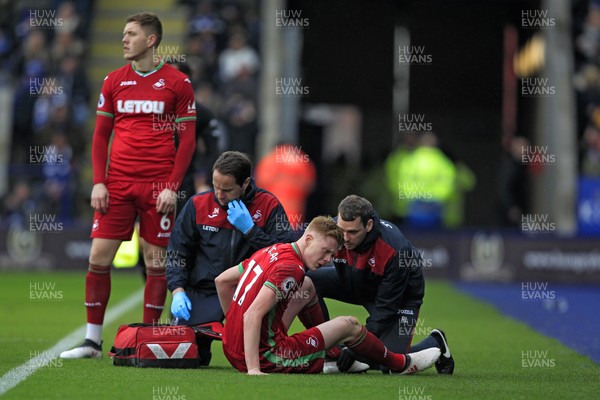 030218 - Leicester City v Swansea City, Premier League - Sam Clucas of Swansea City receives treatment after sustaining an injury