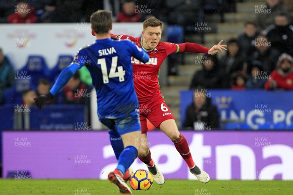 030218 - Leicester City v Swansea City, Premier League - Alfie Mawson of Swansea City (right) takes on Adrien Silva of Leicester City