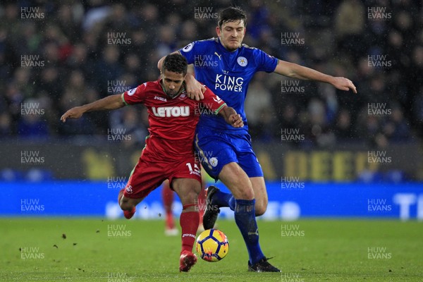 030218 - Leicester City v Swansea City, Premier League - Wayne Routledge of Swansea City (left) and Harry Maguire of Leicester City battle for the ball