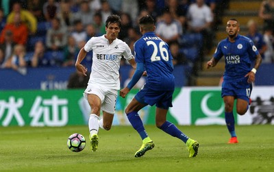 270816 - Leicester City v Swansea City - Premier League - Jack Cork of Swansea City is challenged by Riyad Mahrez of Leicester