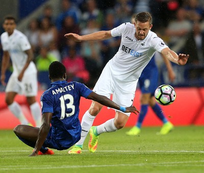 270816 - Leicester City v Swansea City - Premier League - Gylfi Sigurdsson of Swansea City goes past Daniel Amartey of Leicester