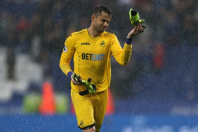 270816 - Leicester City v Swansea City - Premier League - Lukasz Fabianski of Swansea City gives his gloves to the Swans fans