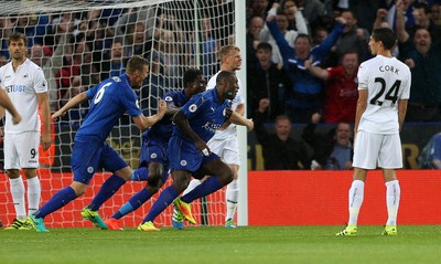 270816 - Leicester City v Swansea City - Premier League - Wes Morgan of Leicester celebrates with team mates after scoring a goal