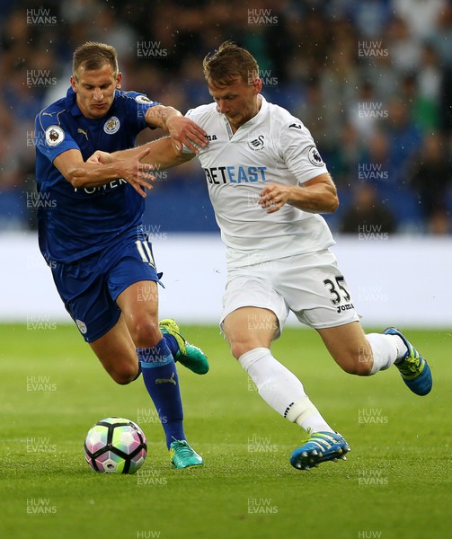 270816 - Leicester City v Swansea City - Premier League - Stephen Kingsley of Swansea City is tackled by Marc Albrighton