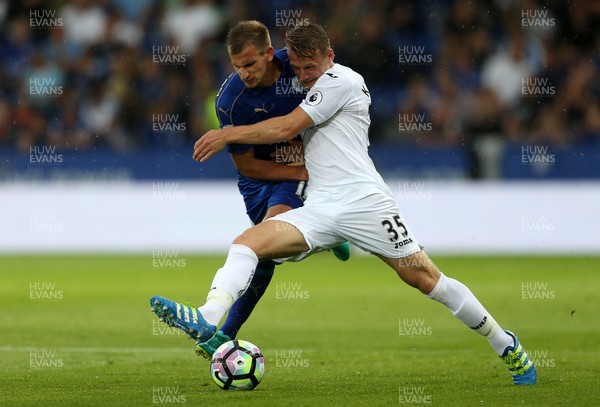 270816 - Leicester City v Swansea City - Premier League - Stephen Kingsley of Swansea City is tackled by Marc Albrighton