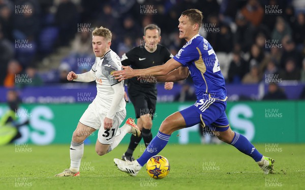 300124 - Leicester City v Swansea City - Sky Bet Championship - Oli Cooper of Swansea and Jannik Vestergaard of Leicester City