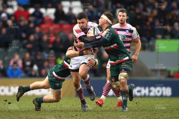 270118 - Leicester Tigers v Cardiff Blues - Anglo-Welsh Cup - Round 3 -  Aled Summerhill of The Cardiff Blues is tackled by Charlie Thacker and Will Evans of Leicester Tigers