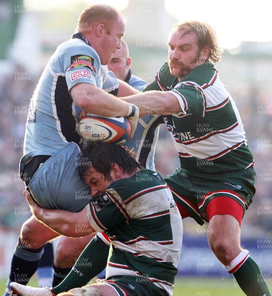 03.11.07 Leicester Tigers v Cardiff Blues... Cardiff's Martyn Williams is tackled by Leicester's Louis Deacon and Andy Goode. 