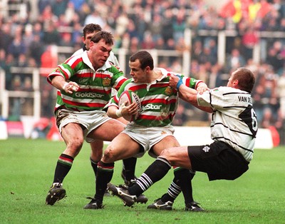 250197 - Leicester Rugby v Brive - Heineken Cup Final - Austin Healey of Leicester is tackled by Loic Van der Linden